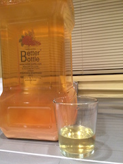 The finished cider, with a glass showing how clear it is.